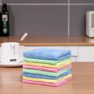 Detailed view of colorful wood fiber dishcloths stacked in a kitchen setting
