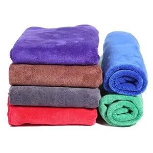 Detailed macro view of colorful thick microfiber car wash towels stacked together neatly