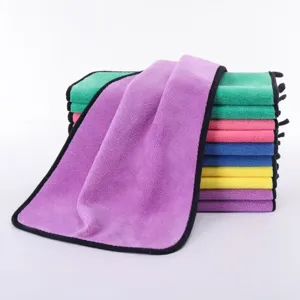 Stack of multi-color microfiber absorbent cleaning cloths for kitchen and car detailing.