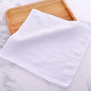 Close-up detail showing the soft cotton texture and weave of a white square hand towel