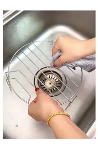 Detailed view of silver wire mesh cleaning cloth scrubbing a circular stainless steel rack
