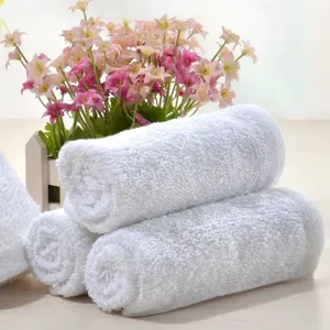 Macro view showing the soft looped texture of premium white 100% cotton towels