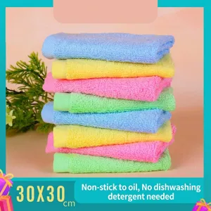 Macro detail of stacked multi-colored wood fiber kitchen cleaning cloths, 30x30cm