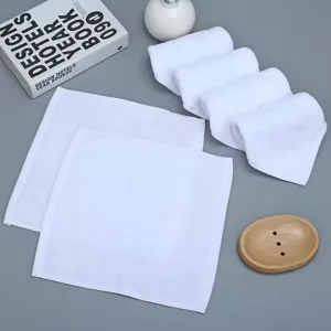 Detailed view of soft pure cotton white square towels on a minimalist background
