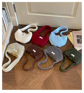 Variety of handmade knit handbags in seven trendy colors for autumn and winter season