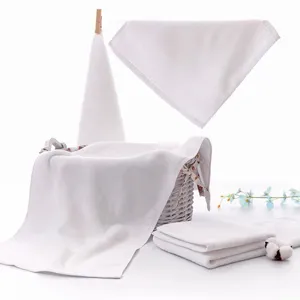 Set of soft white cotton washcloths displayed with aesthetic basket and cotton boll