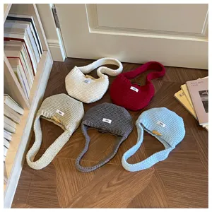 Collection of knitted mini handbags in various colors for autumn and winter