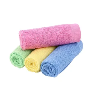 Colorful set of four absorbent wood fiber dish towels for household kitchen cleaning