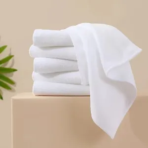 Stack of white absorbent thick microfiber towels showing soft texture and clean design.