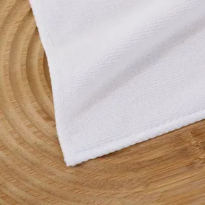 Macro view of the soft white thickened towel texture and the neat edge stitching details