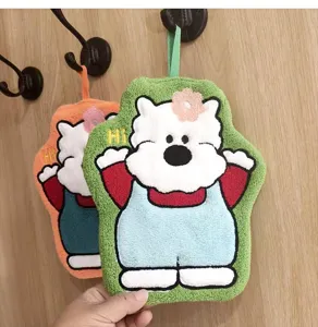 Detail view of cute green cartoon bear coral fleece hanging hand towel with soft texture