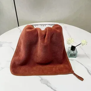 Close-up showing the soft and thick texture of the double-layer coral fleece towel