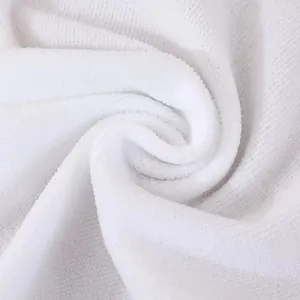 Close-up macro detail of soft white thickened disposable towel showing fine fabric texture