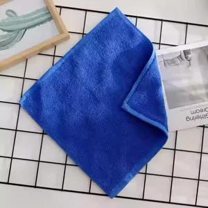 Close-up of a blue absorbent cotton square towel with reinforced edges