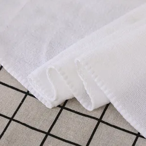 Toalla de baño desechable blanca de alta absorción en tela suave para viajes y hoteles