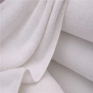 Macro view of white 100% cotton thickened bath towel showing soft absorbent terry texture