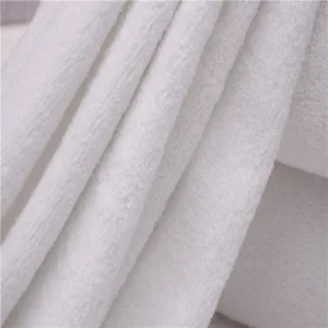 Macro view of thick white absorbent cotton terry bath towel texture