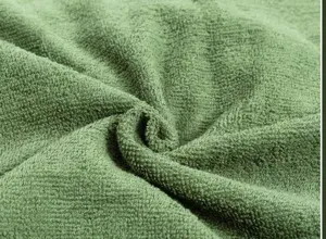 Macro view of army green thickened cotton towel blanket with soft absorbent loops
