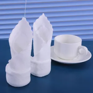 Soft absorbent disposable white square towels for medical, dental, and hospitality use