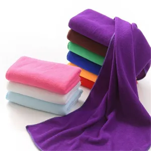 Soft and absorbent microfiber towels in various vibrant colors stacked neatly
