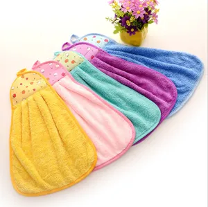 Detailed macro shot of 5 colorful hanging coral fleece hand towels with soft texture