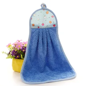 Detailed view of blue coral fleece hanging hand towel with colorful fruit print pattern