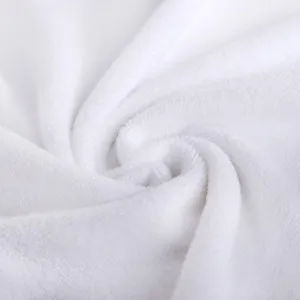 Detailed macro view of soft white microfiber towel texture for hotel and salon use