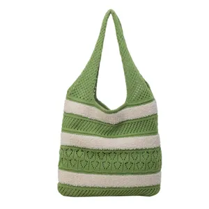 Detailed front view of green and beige striped crochet knit tote shoulder bag