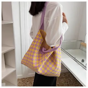Large capacity purple and yellow checkered knitted tote bag worn on woman's shoulder