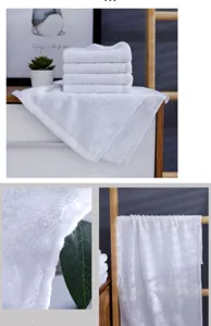 Close-up view of premium thick white cotton towels with soft texture