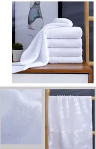 Macro shot of thick white cotton towel fabric showing soft looped texture and material details