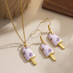 Detailed shot of purple enamel popsicle earrings and necklace set with heart motif