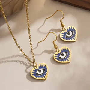 Detailed view of heart-shaped evil eye jewelry set with blue enamel and gold finish