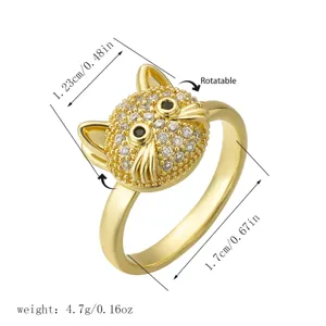 Detailed macro view of rotatable golden cat head ring with sparkling zircons and dimensions