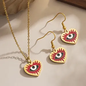 Gold plated evil eye heart jewelry set with necklace and drop earrings.