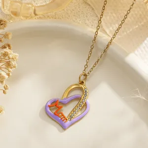 Detailed close-up of a heart-shaped necklace with lavender enamel and 'Mom' lettering
