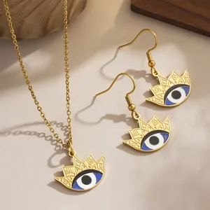 Close-up of retro gold-plated evil eye enamel jewelry set with necklace and earrings