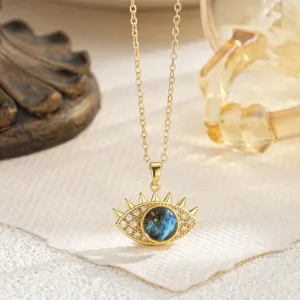 Detail of rotatable gold-plated Evil Eye pendant necklace with blue galaxy center