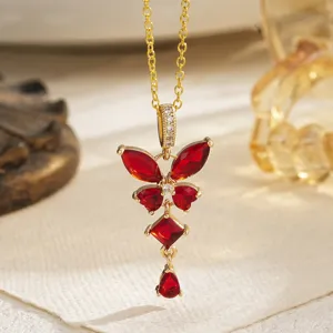 Close-up of vintage style butterfly necklace featuring vibrant red emerald-cut zircon stones