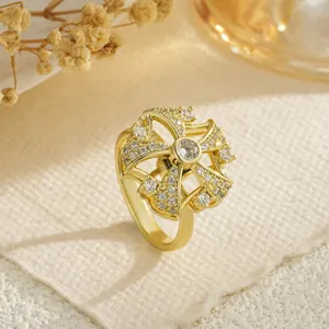 Close-up of golden rotating fidget ring with shimmering cubic zirconia stones