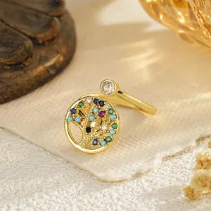 Detailed macro view of a gold plated Tree of Life ring featuring colorful zircon stones