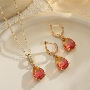 Detail of French vintage gradient waterdrop gemstone jewelry set on a ceramic plate
