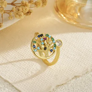 Detailed macro view of gold Tree of Life ring with sparkling colorful zircon stones