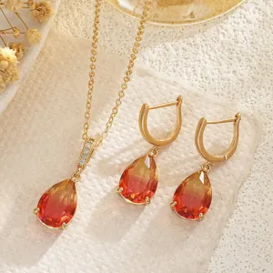 Detailed view of French retro necklace and earring set with gradient teardrop gemstones.