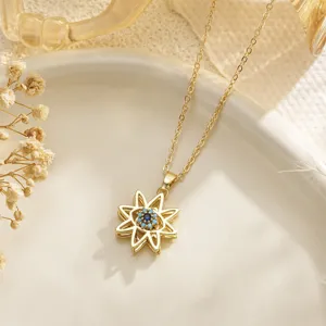 Elegant gold-plated rotating evil eye sunburst pendant necklace with blue stones.
