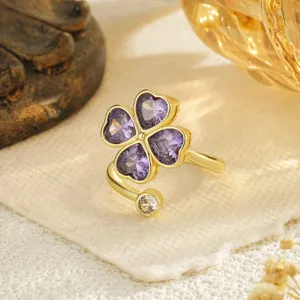 Detailed view of gold-plated rotatable ring featuring purple zircon four-leaf clover