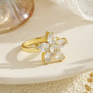 Detailed view of an elegant gold-plated flower ring featuring rotating clear zirconia petals