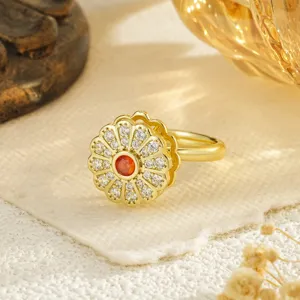 Elegant golden rotatable flower ring featuring orange and white crystal stones for women