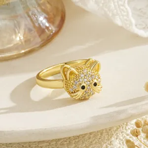 Detail view of a gold cat spinner ring encrusted with sparkling cubic zirconia stones