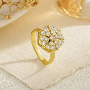 Detailed view of gold-plated rotating ring with brilliant cubic zirconia cluster